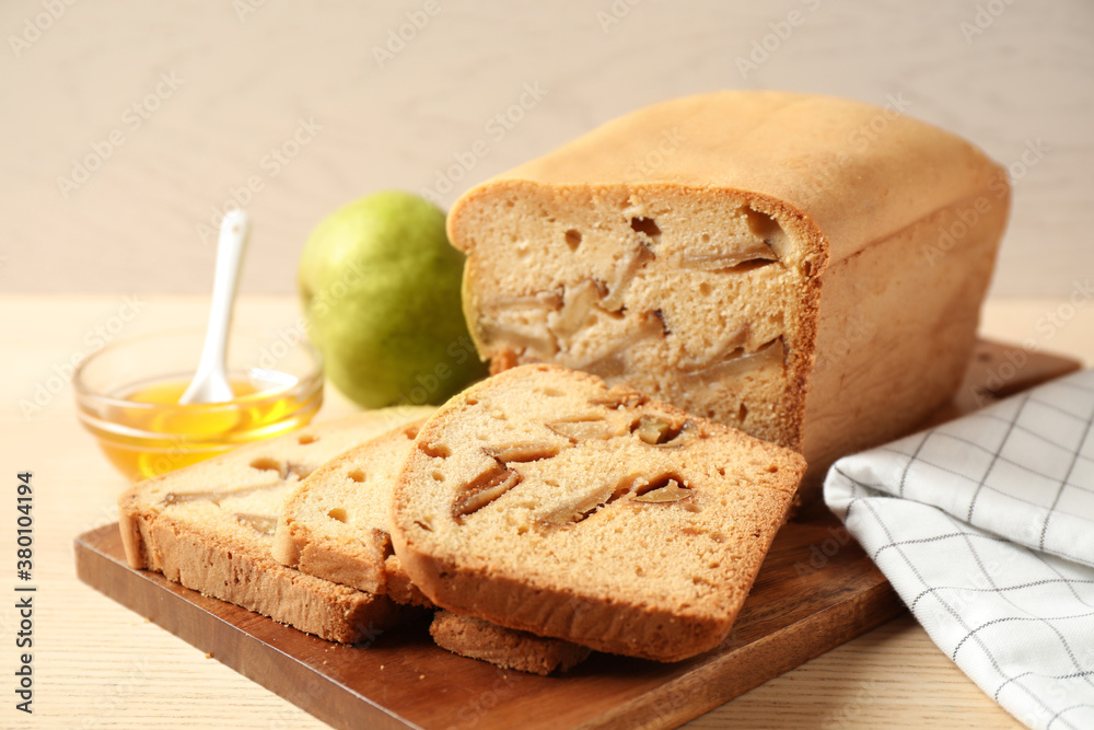 Composition with tasty pear bread on wooden table, closeup. Homemade cake
