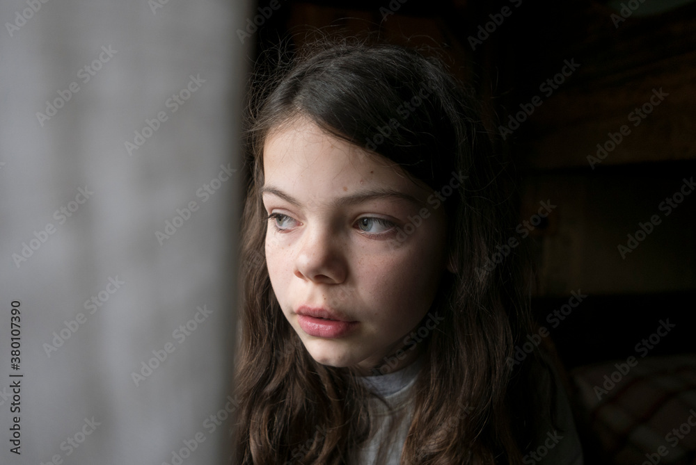 Girl looking out of window Girl looking out of window