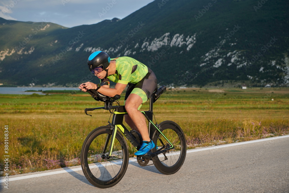 Fototapeta premium triathlon athlete riding bike