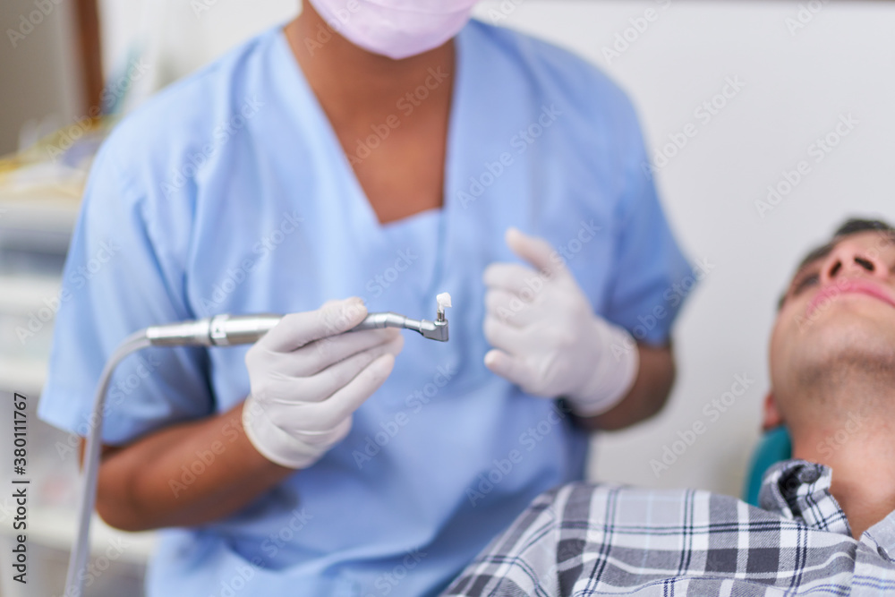 Dentist preparing a treatment Dentist preparing a treatment