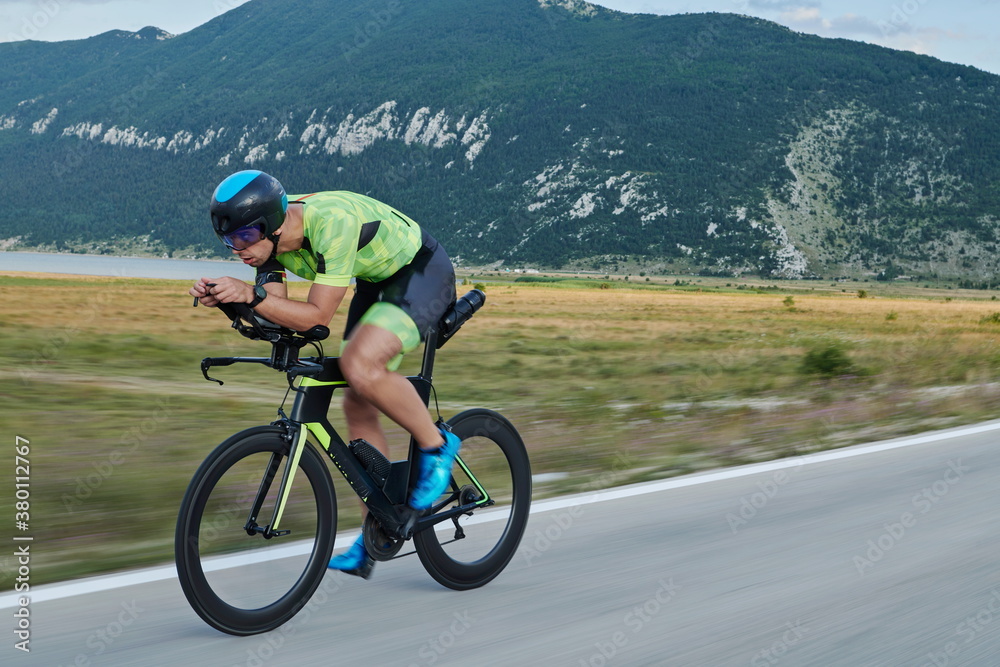 triathlon athlete riding bike triathlon athlete riding bike