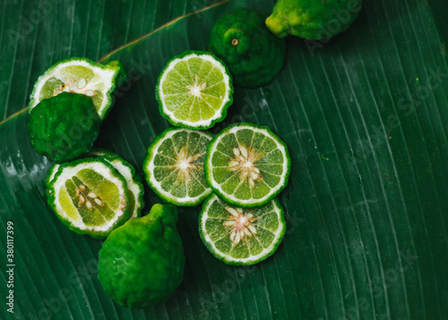 kaffir lime on banana leaf photo