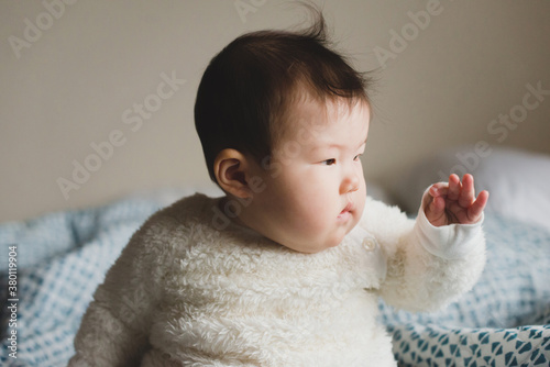 Little baby doing pincer grasp with fingers