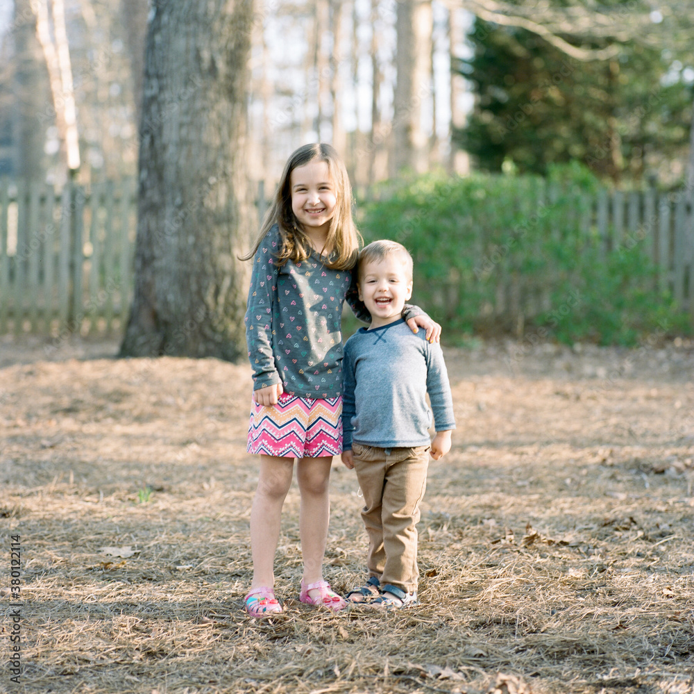 Brother and sister being funny and laughing together Brother and sister being funny and laughing together