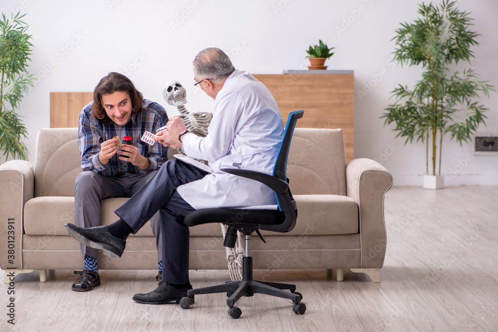 Fototapeta premium Young male patient visiting experienced doctor psychiatrist