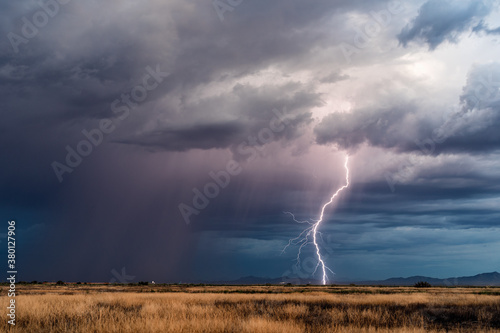 Thunderstorm lightning bolt at dusk