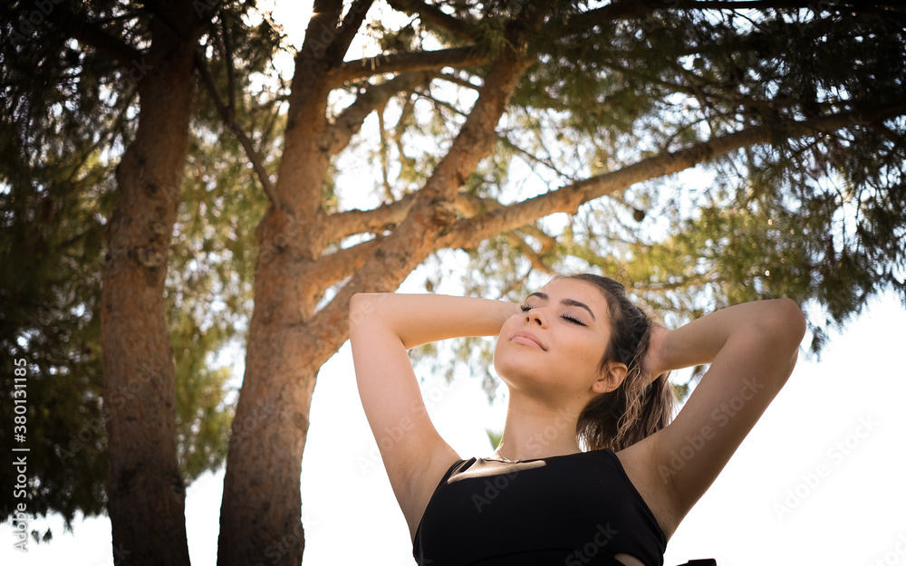 Beautiful young woman relaxing after workout Beautiful young woman relaxing after workout