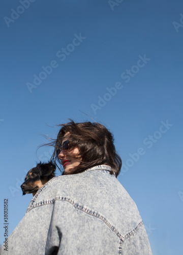 Girl holding her dog photo