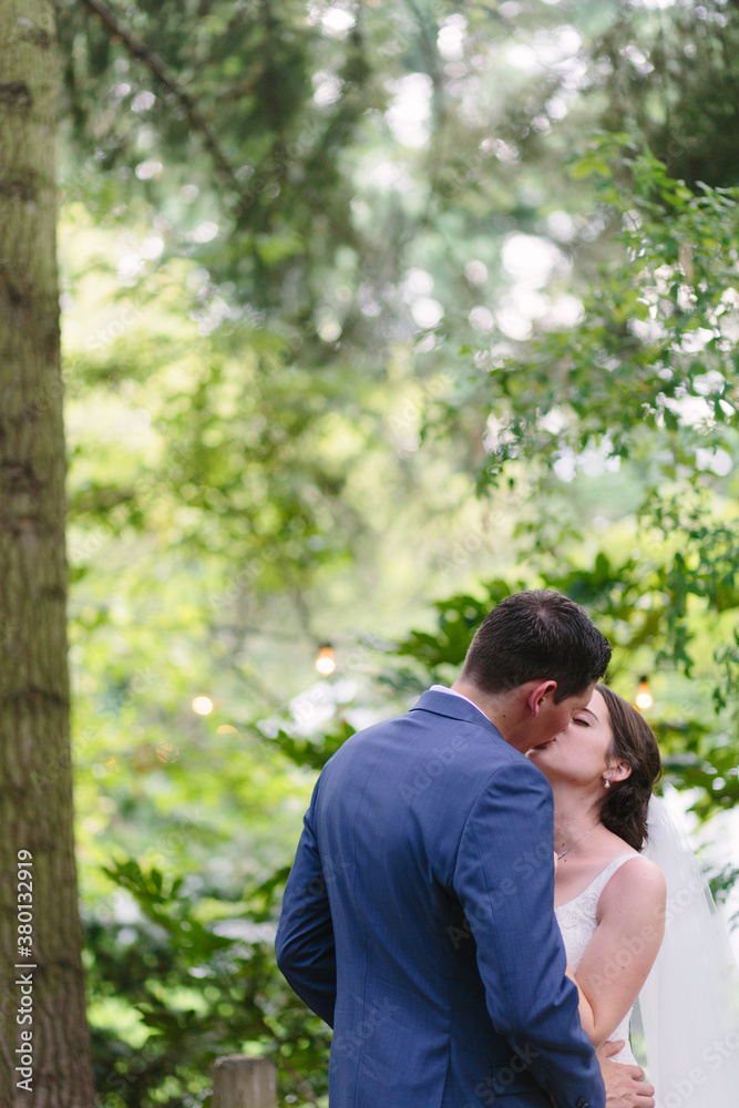 Bride and Groom Kissing at Outdoor Wedding in Oregon Bride and Groom Kissing at Outdoor Wedding in Oregon