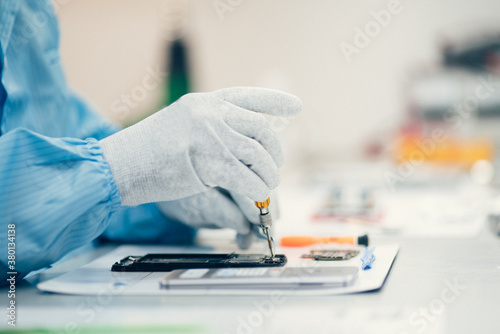 Man repairing smartphone. photo