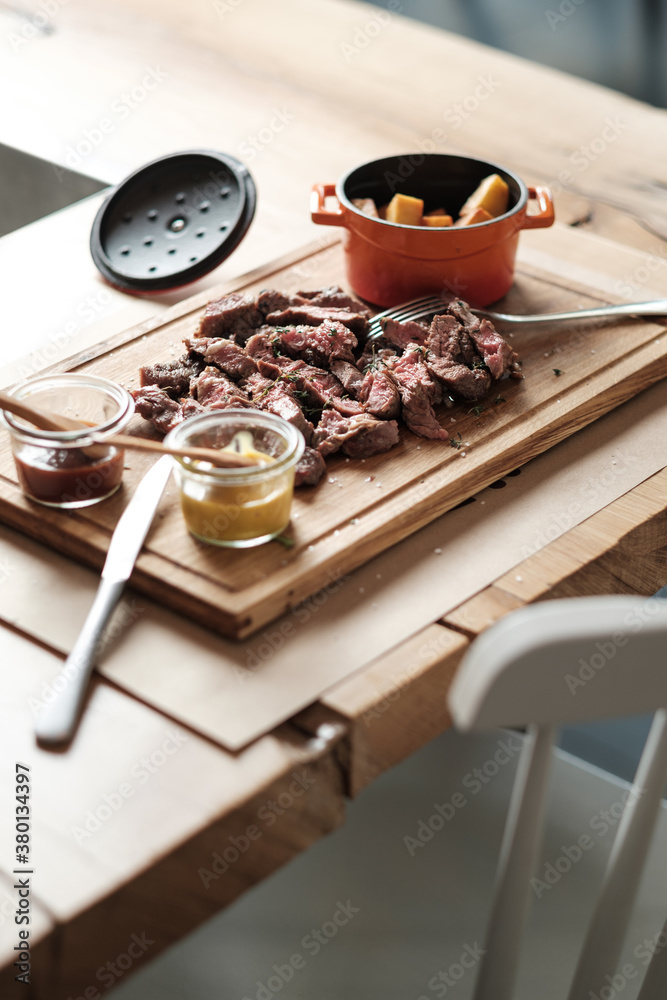 Steak With Dips and Potatoes Served On The Wooden Board Steak With Dips and Potatoes Served On The Wooden Board