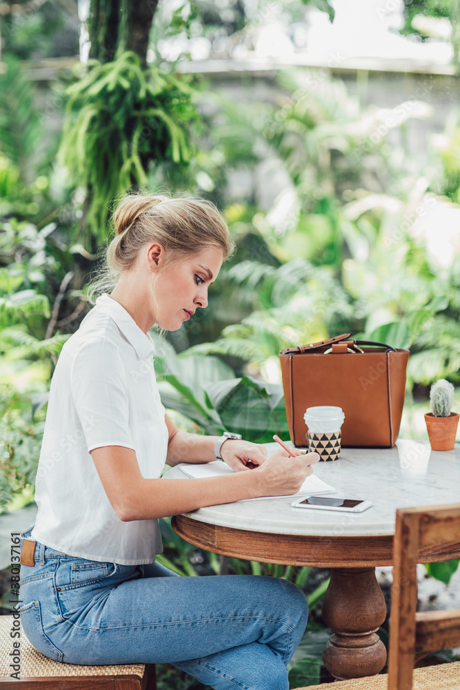 Woman Writing at Cafe Woman Writing at Cafe