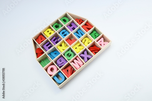 Colorful block letters in the compartment on white background