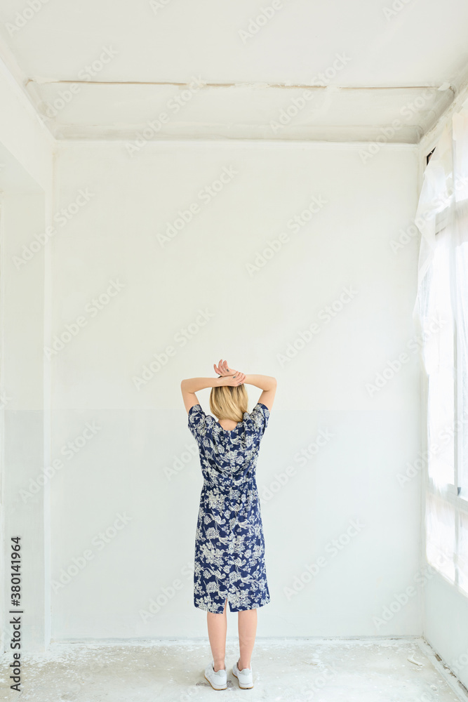 Girl in dress with arms on head. Girl in dress with arms on head.