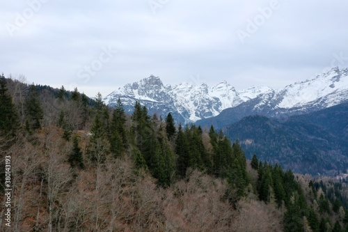 aerial snow covered mountain peaks in alps at winter 