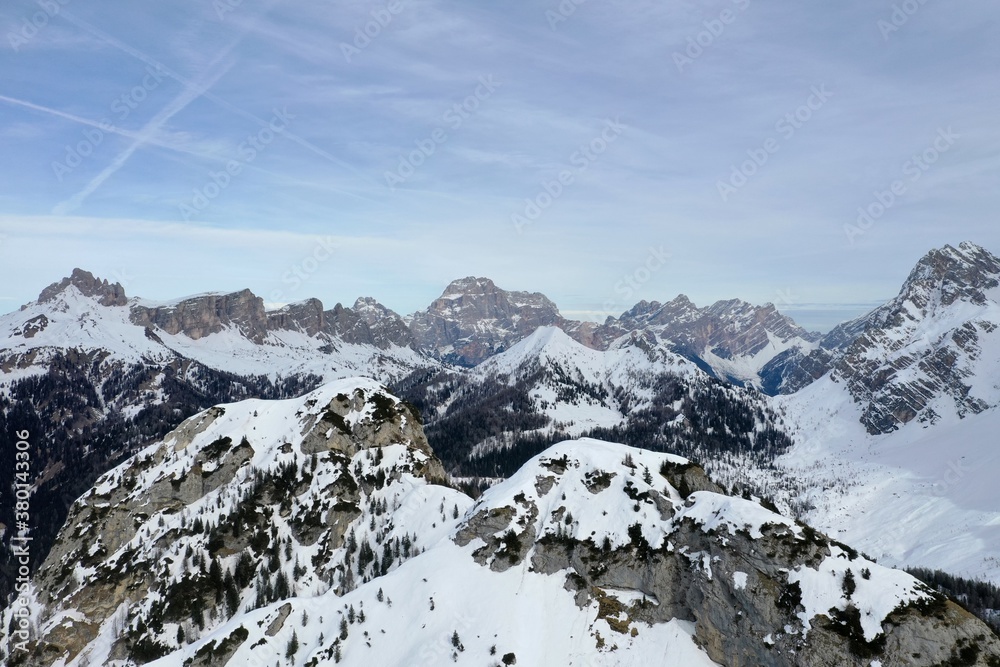 aerial snow covered mountain peaks in alps at winter 