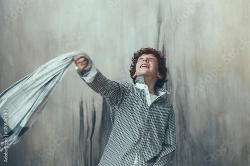 Young boy playing with foulard