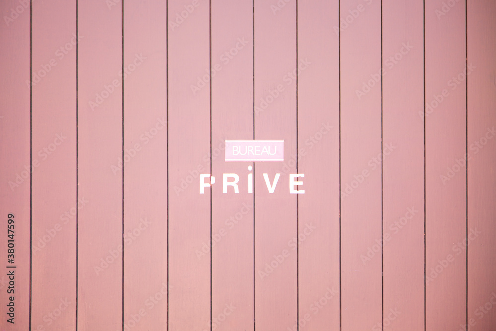 sign private in french on a pink background sign private in french on a pink background