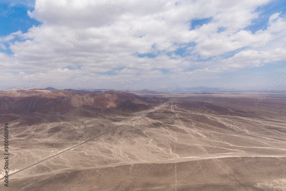 Dry river beds and Panamericana in Nazca Peru seen from air plane Dry river beds and Panamericana in Nazca Peru seen from air plane