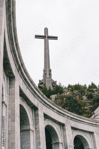 Christian cross monument and arches on basilica in Valle de Los Caidos, Madrid, Spain photo