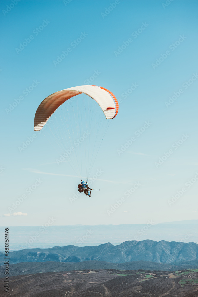 Man practicing paragliding on the mountains Man practicing paragliding on the mountains