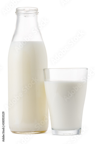 Glass cup and bottle of fresh milk isolated