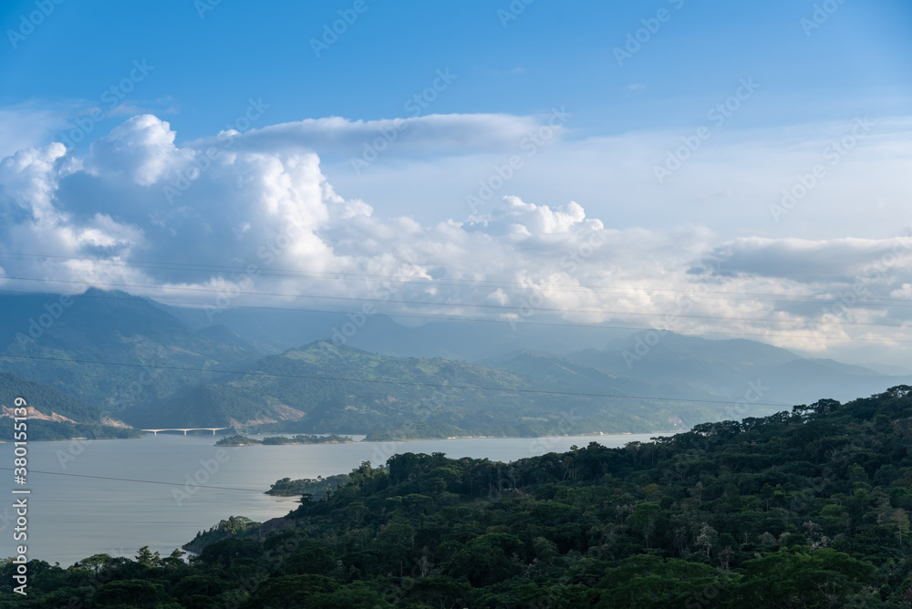 Dam in colombia surrounded by lush vegetation and with a bridge Dam in colombia surrounded by lush vegetation and with a bridge