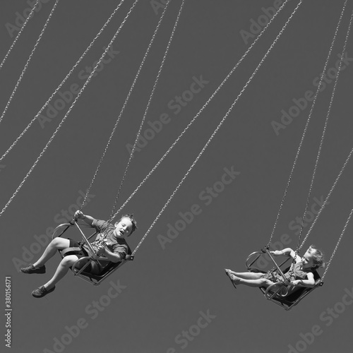 boy and girl on wave swinger ride