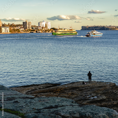 Person observing the ships leave the harbour 