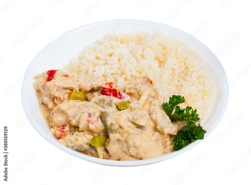Chicken fillet red curry with jasmine rice. Isolated over white background