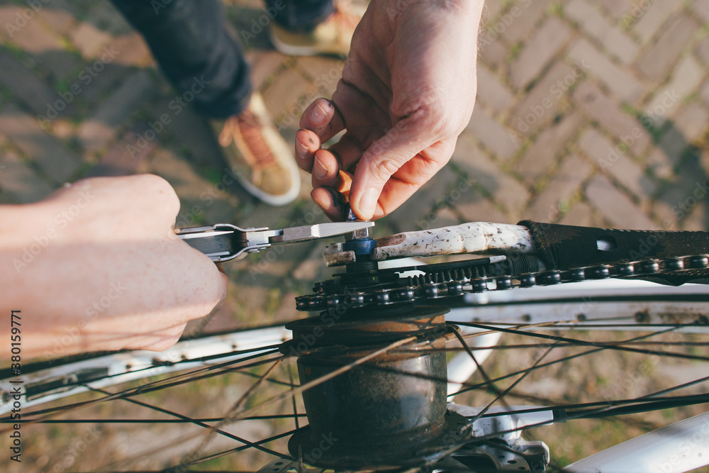 Fixing bicycle wheel with hands and tool. Fixing bicycle wheel with hands and tool.