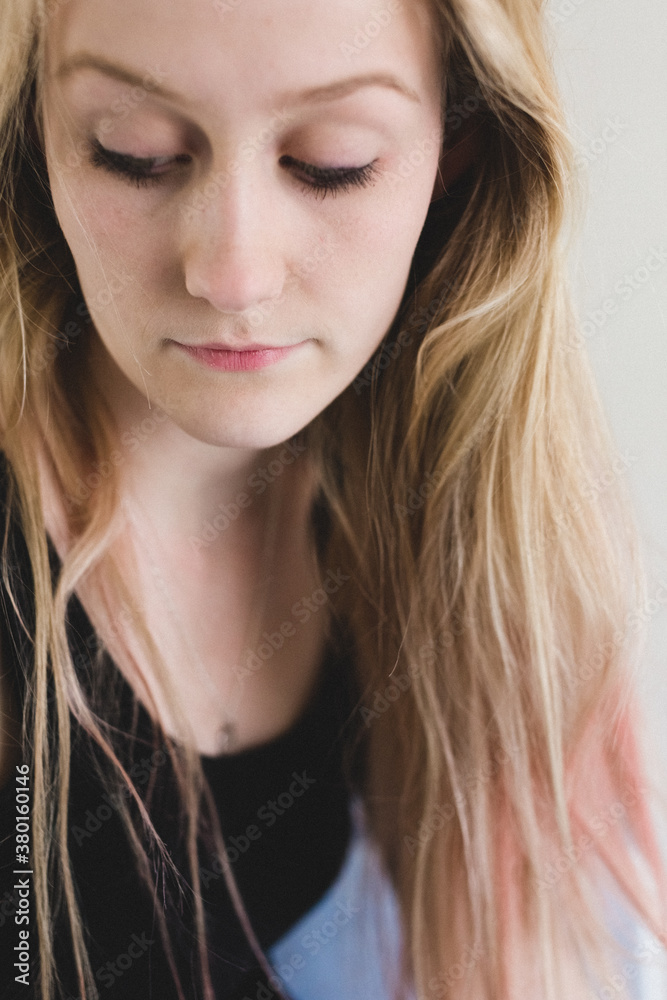 Close up portrait of a pretty young woman with long blonde hair. Close up portrait of a pretty young woman with long blonde hair.