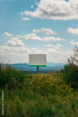 sign in the middle of the field photo