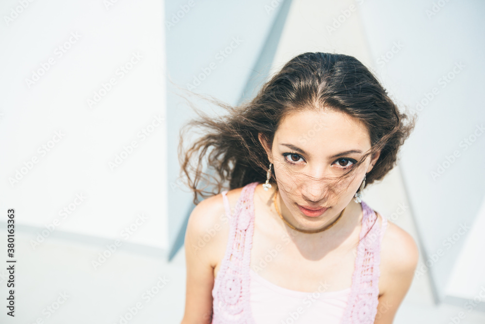 Portrait of pretty young woman looking at camera Portrait of pretty young woman looking at camera