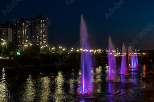 Fountains music light show on Rusanovka channel in Kyiv, Ukraine. Very beautiful fountains with illumination.