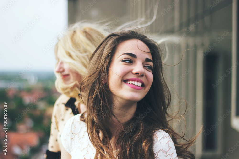 Portrait of a beautiful young woman with wind in her hair Portrait of a beautiful young woman with wind in her hair