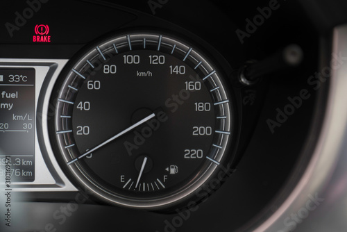 Dashboard on car showing car speedometer and Rpm. 