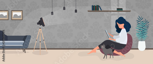 The girl sits on an ottoman and works at a laptop. A woman with a laptop sits on a large pouf. The cat rubs against the girl's leg. The concept of comfortable work in the office or at home. Vector.
