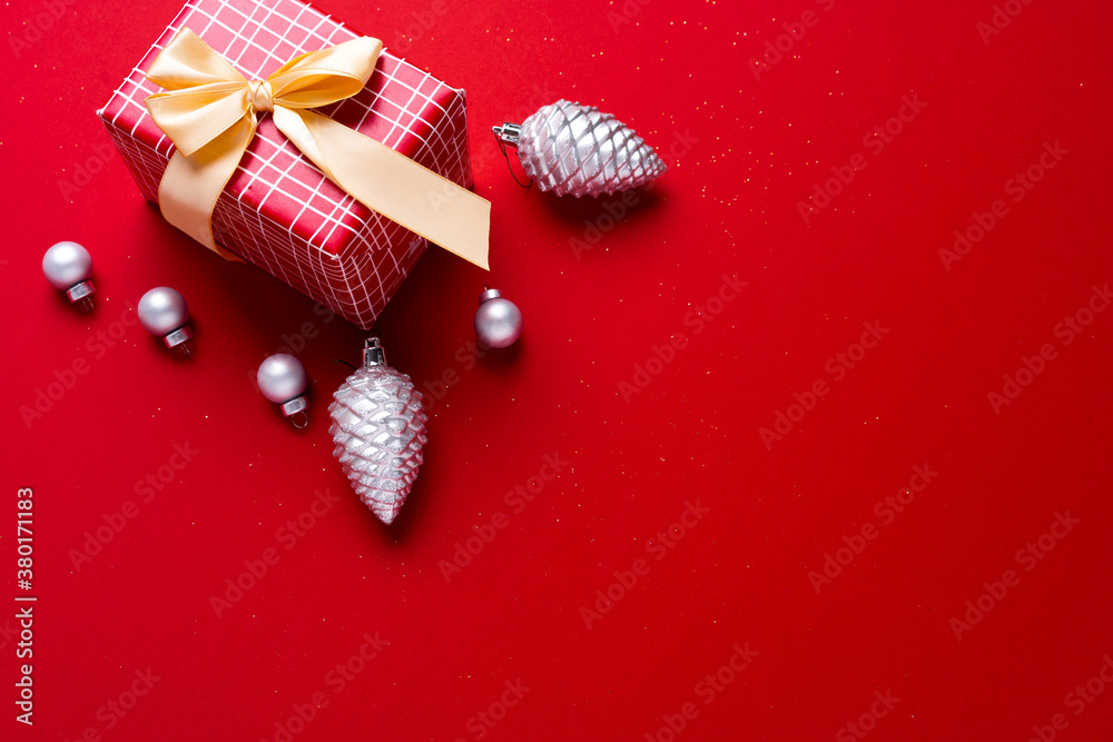 Christmas baubles and wrapped gift decorated with bow