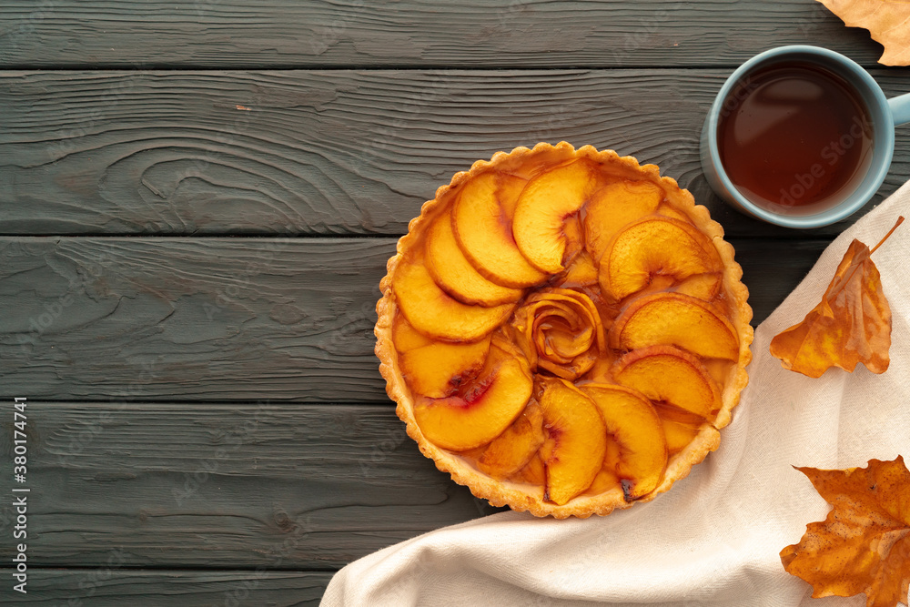 Homemade traditional sweet autumn tart pie on wooden table Homemade traditional sweet autumn tart pie on wooden table