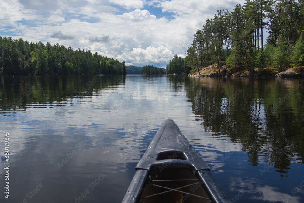 Prow of a canoe on a lake. Prow of a canoe on a lake.
