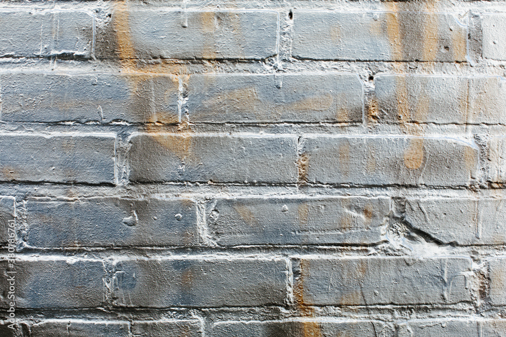 Silver graffiti paint on brick wall, close up Silver graffiti paint on brick wall, close up