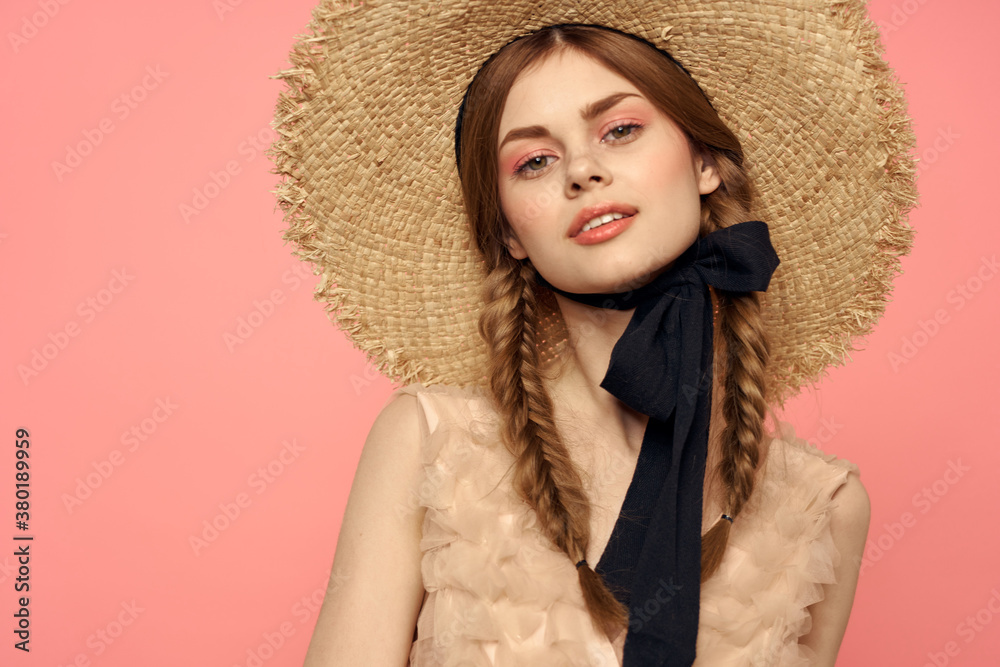 Beautiful woman in hat and in black dress ribbon portrait pink background model Beautiful woman in hat and in black dress ribbon portrait pink background model