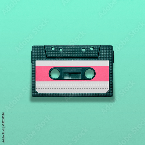 Retro audio cassette isolated on blue background, pop art design, close up