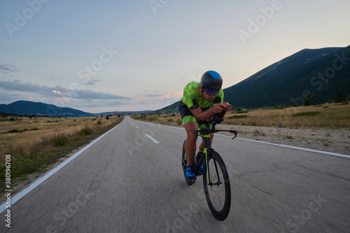 Fototapeta Naklejka Na Ścianę i Meble -  triathlon athlete riding bike