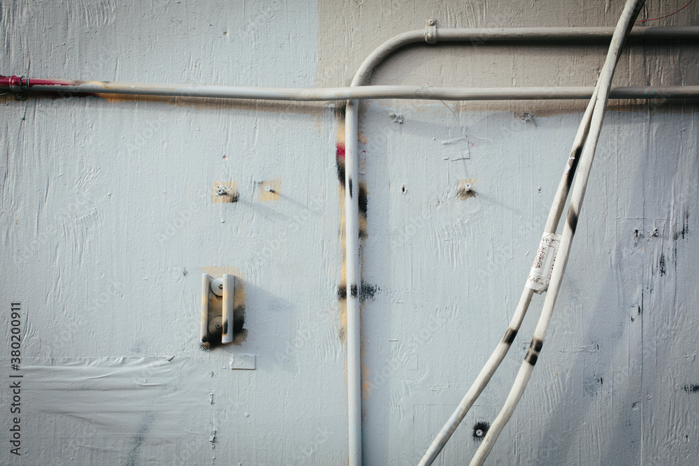 Electrical wires on building wall Electrical wires on building wall