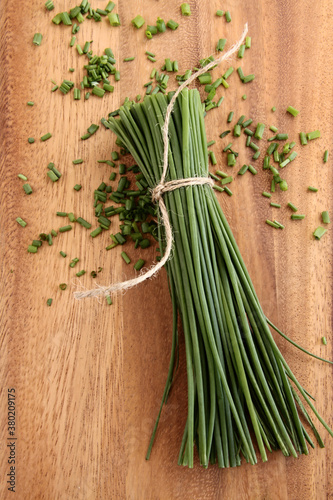 Chives on an wooden board photo