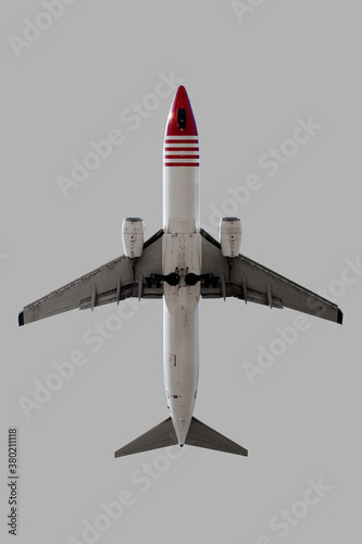 Airplane over grey background.