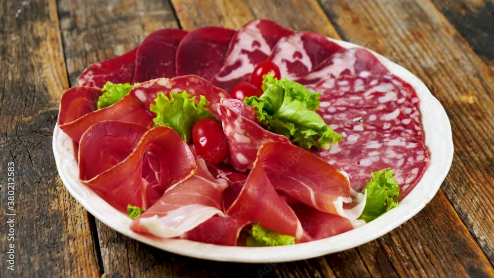 assortment of sliced meats- prosciutto ham, salami, bacon assortment of sliced meats- prosciutto ham, salami, bacon