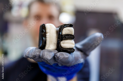 Lollyologist holding up candy letters IE photo